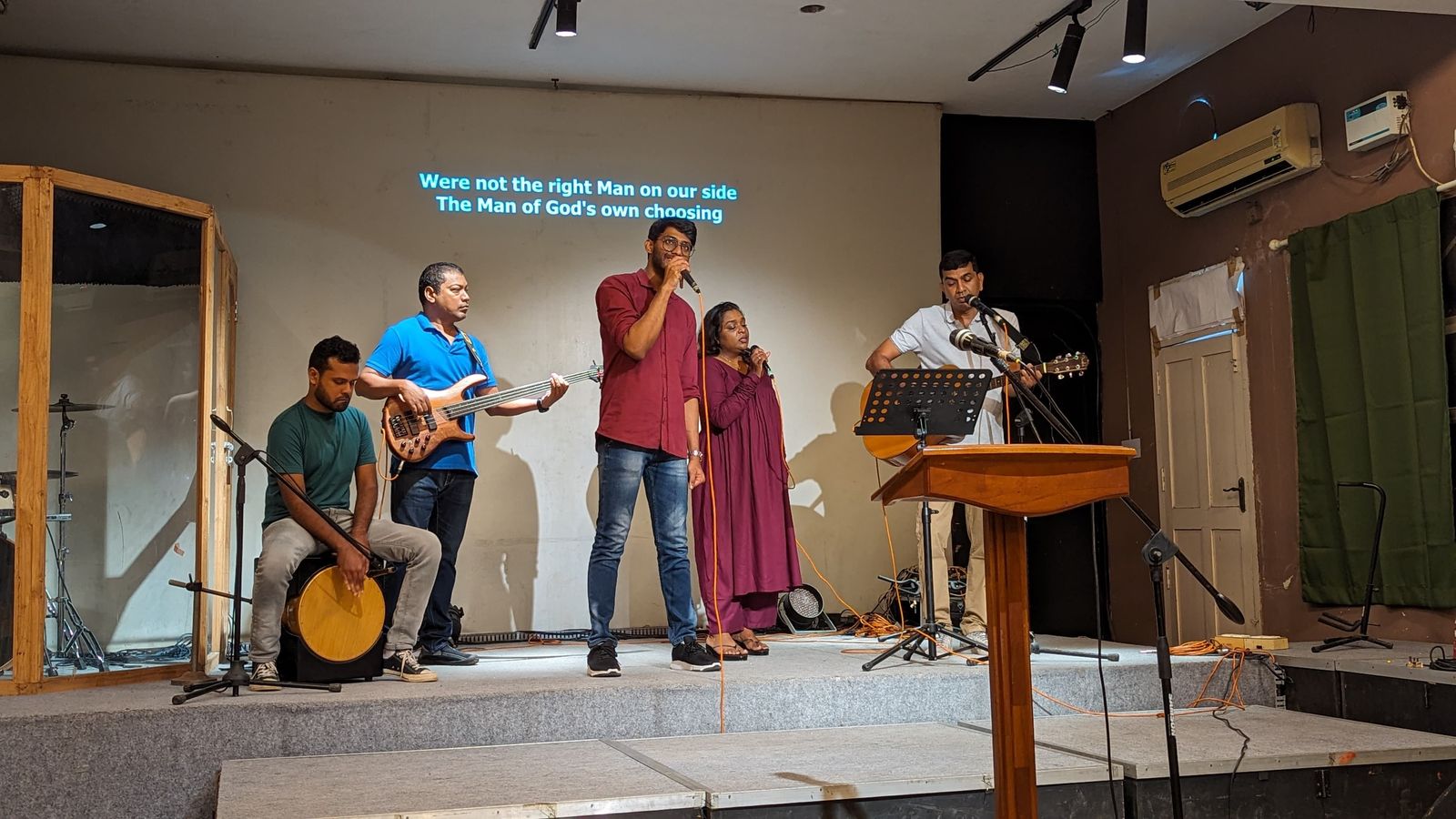 The worship band with cajón, bass, vocals and acoustic guitar