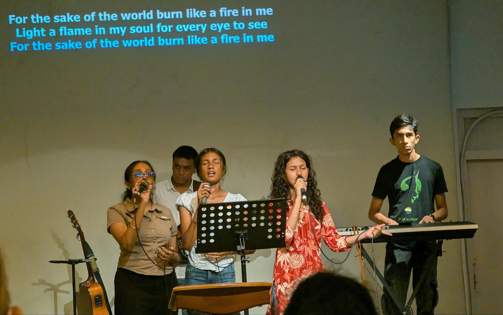 Young vocalists and keys leading worship